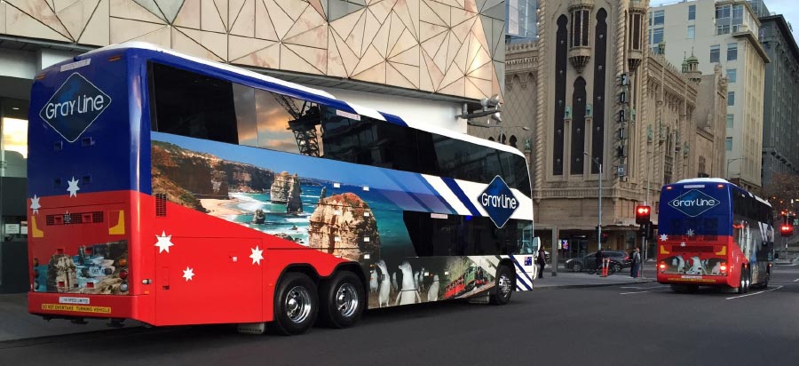 Gray Line double decker coaches departing federation square